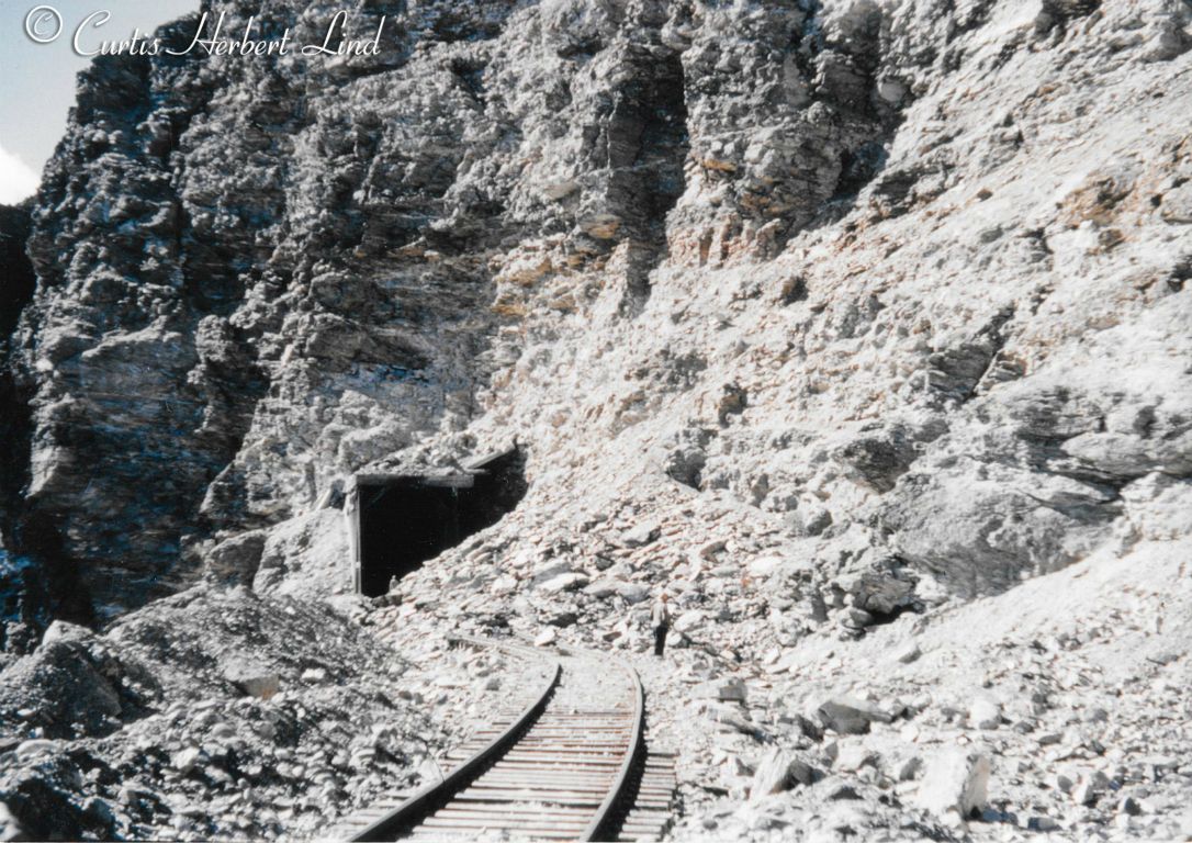 Rock slide at the North entrance to the Garner Tunnel MP 356.2. Lets just call it rotten stone which was always weathering away. That rock outcrop guarded the North end of the Nenana Canyon and was a constant problem until it was finally blasted away and the tunnel daylighted. 