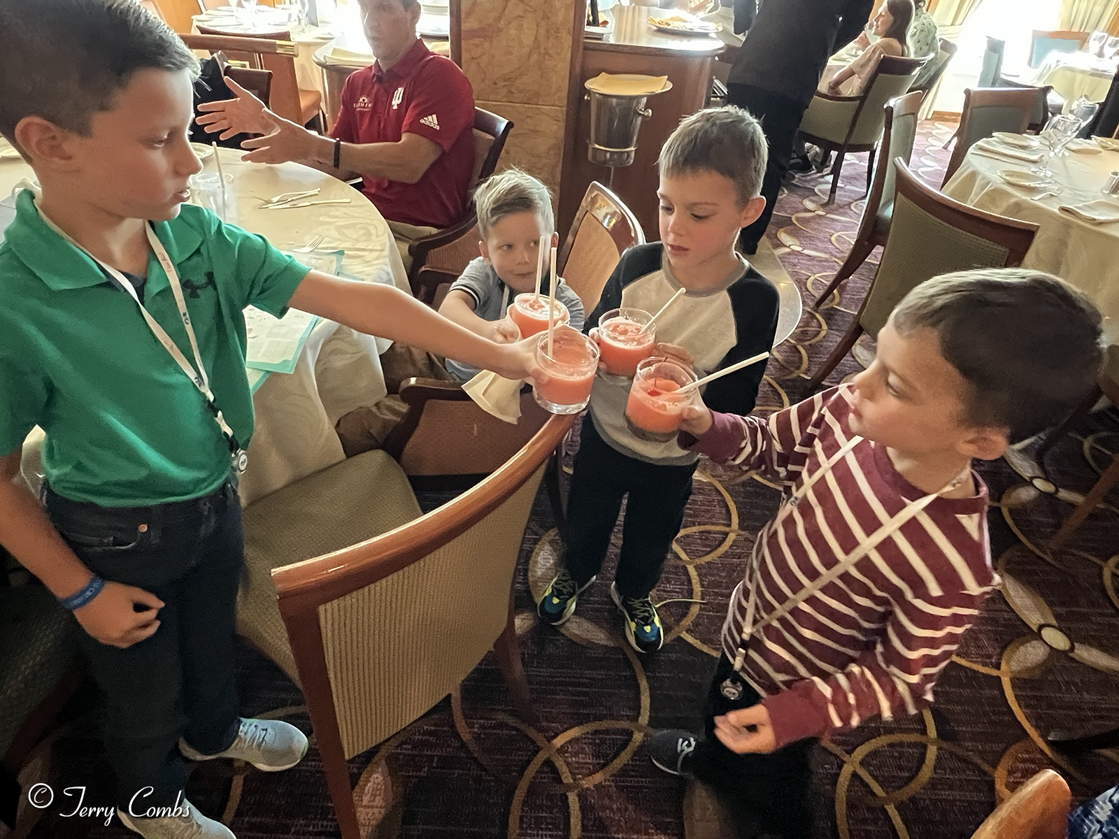 Grandsons toasting the voyage with their sunrise daiquiris.